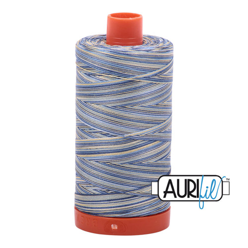 Large spool of Aurifil Lemon Blueberry 50wt Egyptian cotton thread, blue and yellow variegated with Aurifil logo