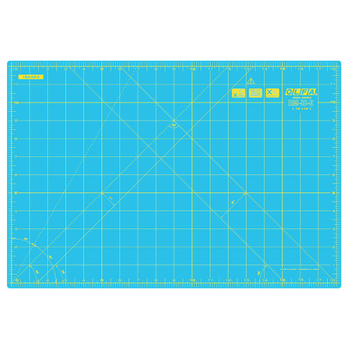 OLFA Aqua Rotary Cutting Mat with double-sided inch and metric grids, designed for accurate fabric cutting