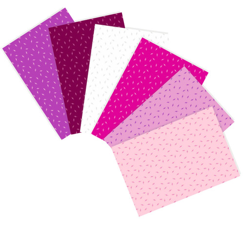 6 Atomic Flowerbed fat quarters from Andover Fabrics, fanned out showcasing vibrant pink and purple hues.