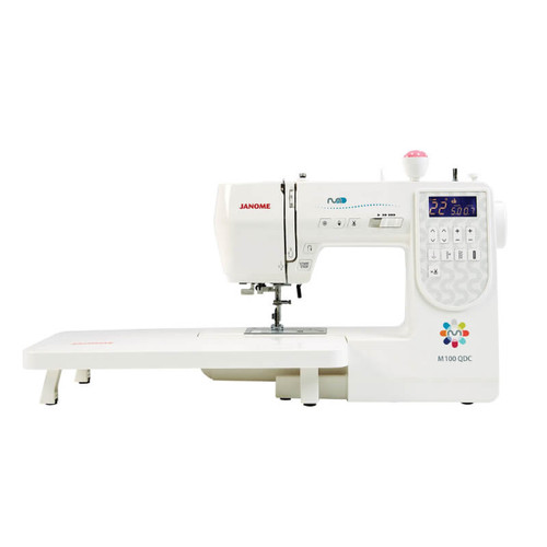 Janome M100 QDC sewing machine with an extension table, showcasing its sleek design and modern digital display. Perfect for quilting projects. Janome M100 QDC sewing machine with an extension table, showcasing its sleek design and modern digital display. Perfect for quilting projects.