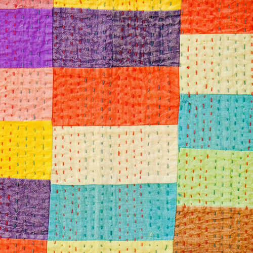 Bright patchwork quilt in Kawandi style featuring large fabric rectangles in bold colours including purple, orange, yellow, turquoise, and cream, hand-stitched with colourful running stitches. Bright patchwork quilt in Kawandi style featuring large fabric rectangles in bold colours including purple, orange, yellow, turquoise, and cream, hand-stitched with colourful running stitches.