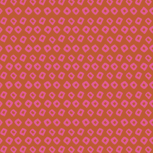 Close up Shibori in Wildrose quilting cotton fabric by Heather Ross for Windham Fabrics, featuring hand-drawn pink diamonds on a rich rose-orange background.