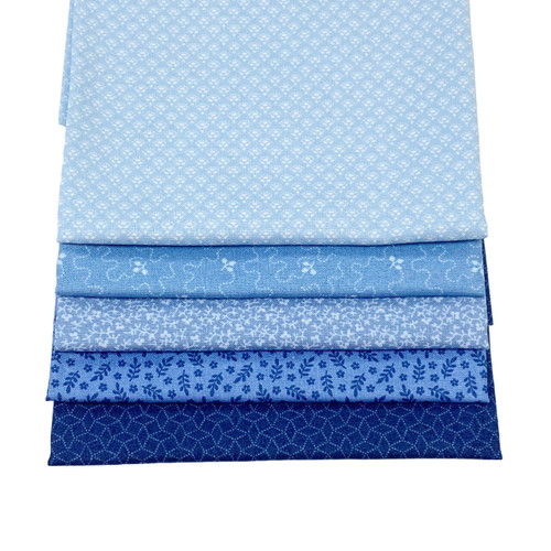 Collection of six blue fat quarters from Andover Fabrics' Tonal Ditsy Blue Indigo collection