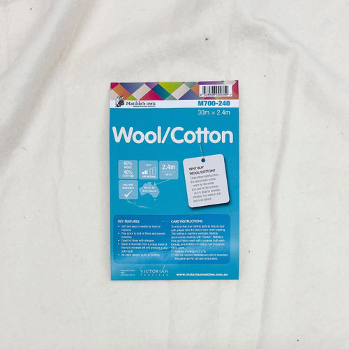 Product packaging for Matilda’s Own Wool/Cotton wadding laid on top of batting, highlighting fibre content, features, care instructions, and branding. Product packaging for Matilda’s Own Wool/Cotton wadding laid on top of batting, highlighting fibre content, features, care instructions, and branding.