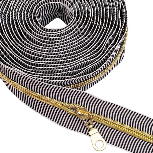 Close-up of gold coil on Black Stripe tape with teardrop pull attached