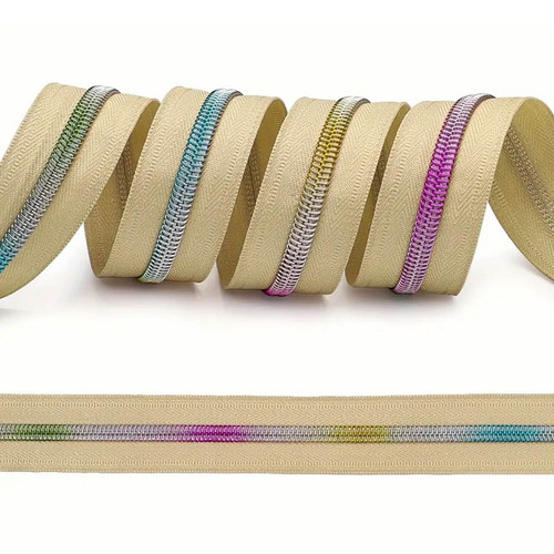 Close-up of rainbow metal-look coil on tan tape