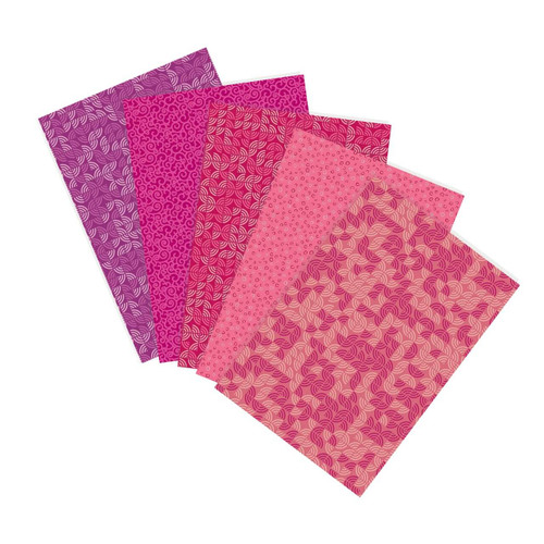 Wild Berry Patch fat quarter bundle featuring pink, raspberry and coral quilting cottons with geometric patterns fanned out