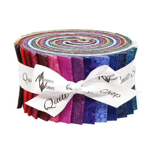 Gudrun Erla Heima strip roll – multicolour 2.5" WOF fabric strips featuring glacier textures, lichen lines, pebble blenders and knit star motifs, tied with a Morris Works ribbon.