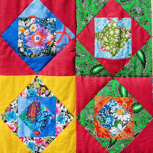 Colourful quilt blocks showing accurate angles and alignment using foundation paper piecing