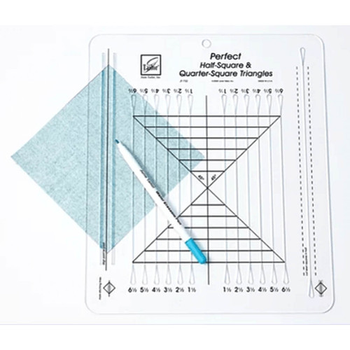 A clear image of the June Tailor Half and Quarter Square Triangle Ruler in action, with a blue fabric triangle beneath it and a marking pen drawing precise lines following the ruler's guidelines for accurate cutting and piecing.
