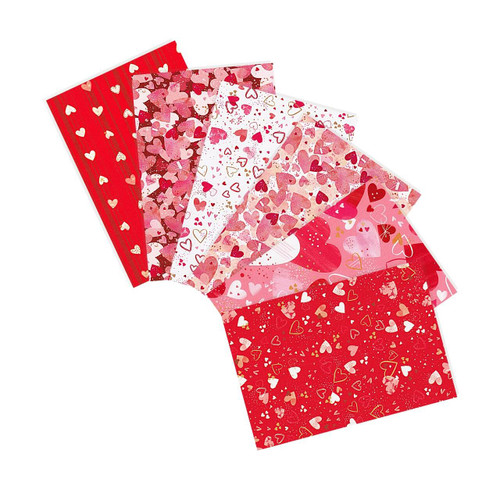 Charming Love Fat Quarter Bundle by Robert Kaufman featuring heart print quilting cottons in red, pink, cream, and blush tones