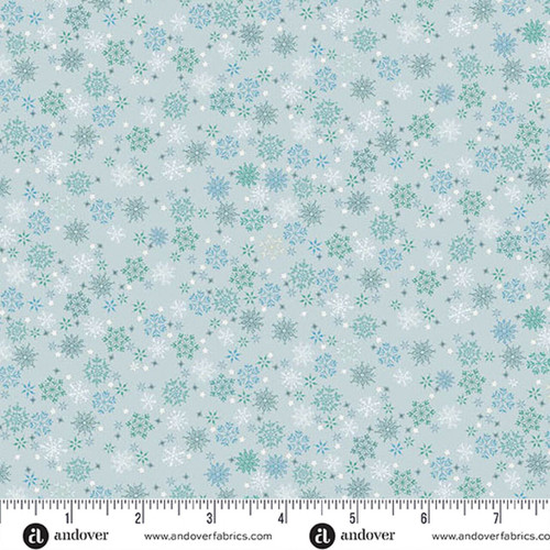Makower UK Country Christmas Frosty in Blue quilting fabric featuring delicate white, blue and green snowflakes on a soft blue background with ruler for scale