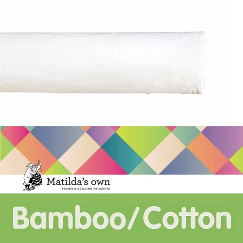 A roll of Matilda's Own Bamboo Cotton Quilt / Cotton Wadding, a premium-quality, natural quilt batting. The wadding appears soft and white, rolled neatly. Below the roll, there is a colourful, geometric-patterned banner featuring the Matilda's Own logo, which includes a small illustration of a sheep holding a quilt. The bottom section has a bright green background with the word "Bamboo" in bold white letters, emphasising the product’s natural fibre composition.