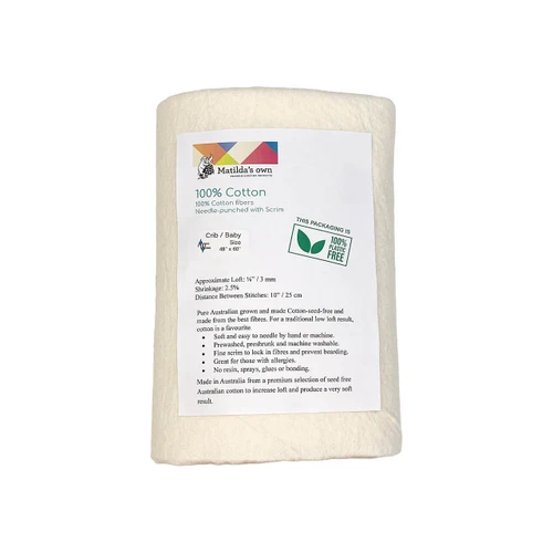 A packaged Matilda's Own Scrim Free 100% Cotton Quilt Wadding in baby size (48" x 60"), wrapped in eco-friendly plastic-free packaging. The front label displays key product details, including its composition of 100% cotton fibres, needle-punched with scrim. The packaging highlights features such as an approximate loft of ⅛ inch (3mm), a shrinkage rate of 2.5%, and a maximum stitch distance of 10 inches (25cm). The label also describes the wadding’s sustainability, antibacterial properties, and softness, making it suitable for bedding and baby quilts. A green "100% Plastic Free" logo is visible, reinforcing the environmentally friendly packaging.