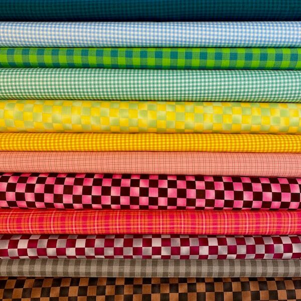 Versatile Checkered Fabric Bolts Stacked for Memorable Quilting Projects