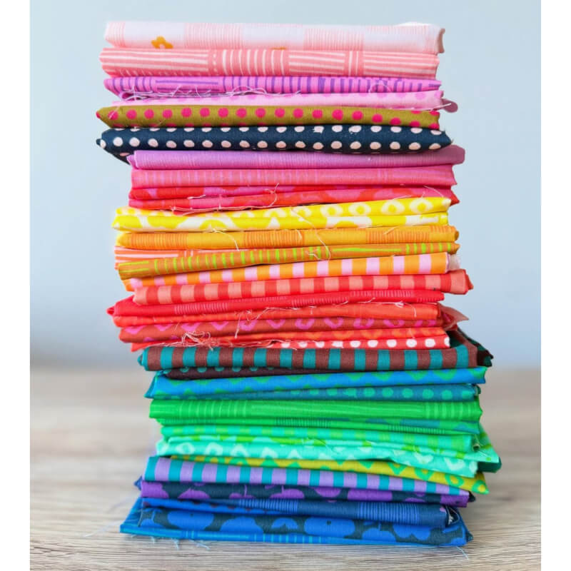 Stack of Ft Quarters for Ruby Bee Blender on a table top