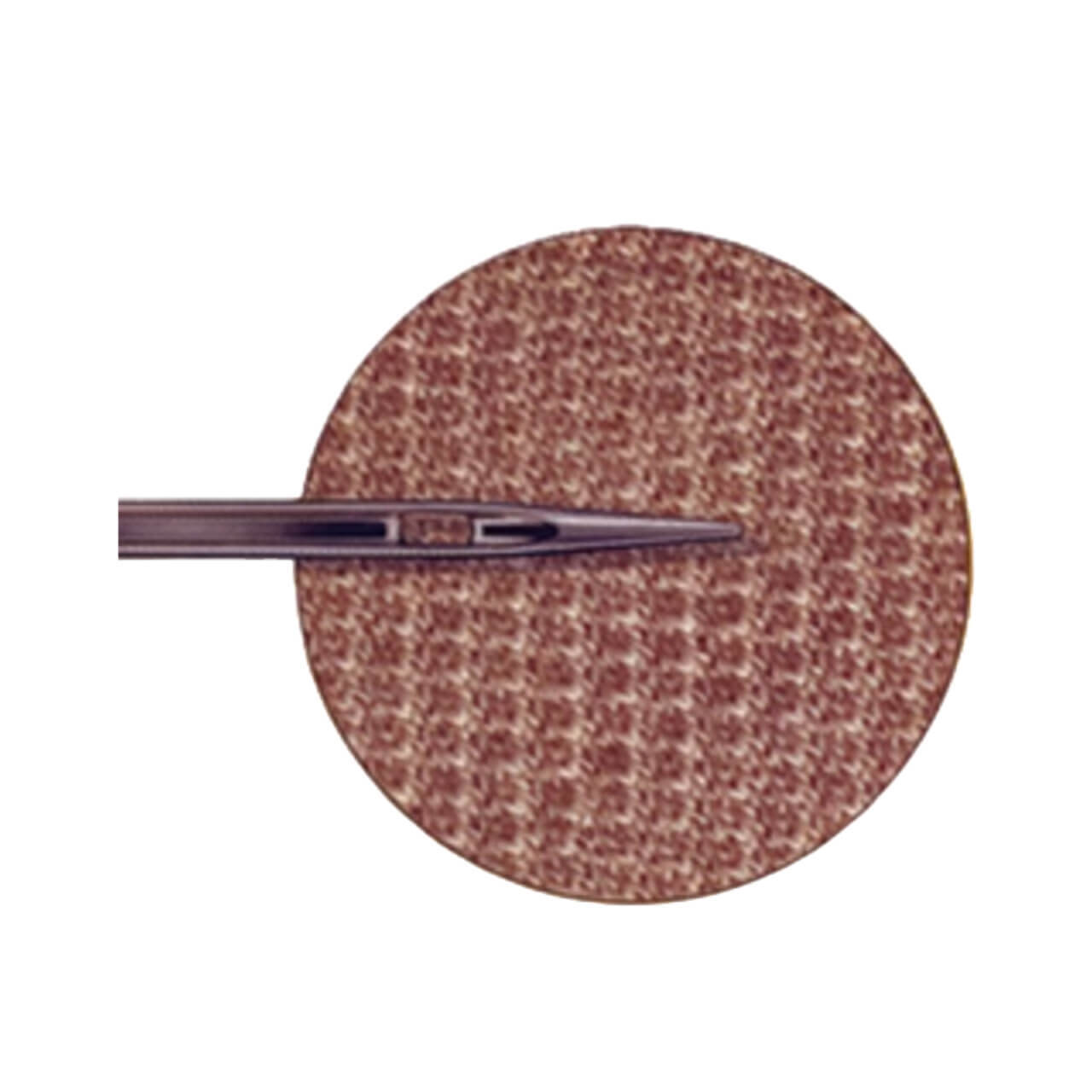 Jersey needle tip over a brown knit fabric