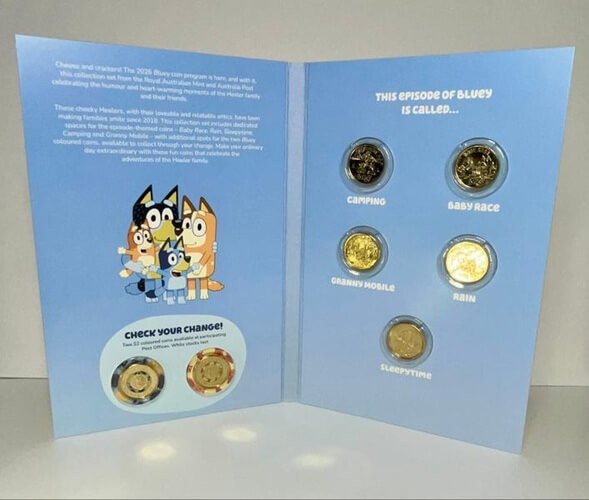 RAM 2026 Bluey complete set with all 7 uncirculated coins, view of open book & all coins positioned inside, including the 2 additional collectable $2 coloured coins of Bluey & Bingo