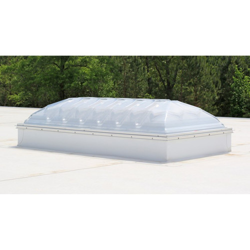Velux CMD2 double dome skylight installed on a white roof edge with trees in the background