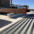 AES-3 equipment rail supporting a rooftop unit platform