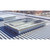 AES roof curb with safety grid installed on a corrugated metal roof