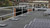 KattGuard GR34 guardrail on an urban rooftop lined with solar panels and city rowhouses