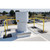 Yellow rooftop guardrail encircling a large exhaust stack, with a parking lot visible below