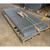 Stacked wire mesh guard grates strapped on a pallet in a warehouse, shipping photo