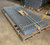 Stacked wire mesh guard grates strapped on a pallet in a warehouse, shipping photo