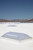Sunoptics dome skylights installed on a white commercial roof with mountains in the background