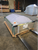 Sunoptics dome skylight strapped and crated on a wooden pallet inside a warehouse, ready for shipping