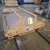 Sunoptics skylight crated on a wooden pallet with a protective wire cage, ready for shipping