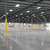 Interior of an empty warehouse daylit by ceiling-mounted Sunoptics skylights