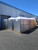 Stacked, wrapped Sunoptics skylight pallets staged outside the warehouse
