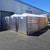 Stacked, wrapped Sunoptics skylight pallets staged outside the warehouse