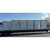 Row of wrapped Sunoptics skylight crates loaded on a flatbed truck for delivery