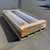 Sunoptics SVT2 smoke vent packaged in a wooden shipping crate on a pallet outdoors