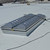 Technician wiring a Sunoptics SVT2 smoke vent during rooftop installation on a white membrane roof