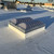 Sunoptics SVT2 smoke vent on a rooftop with other rooftop equipment and palm trees visible in the background