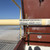 Bil-Guard 2.0 roof hatch railing label on the rail of an open Bilco S-20 hatch