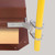 Detail shot of the yellow guardrail base bracket clamped to the red roof hatch curb