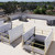 Aerial view of two open roof hatches with yellow Bil-Guard rail systems on a white membrane roof