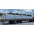 Row of wrapped Velux skylight pallets lined up on a flatbed trailer for delivery