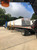 Wrapped CMD2 skylight pallets strapped to a flatbed truck for shipping