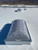 Aerial view of the Velux CMD2 skylight installed on an expansive white roof