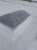 Velux CMD2 double dome skylight installed on a white TPO roof, close field photo angle