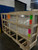 Velux shrink-out smoke vent crated in wood framing with fragile shipping labels