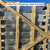 Example Curbs Plus shipping label on a wood-crated stack of roof curbs