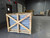 Curbs Plus Z-frame safety screen crated in a wooden shipping frame, warehouse photo