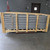Curbs Plus Z-frame safety screen crated in wood framing, side view showing metal ribs